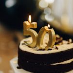 birthday cake with lighted candles on top