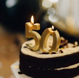 birthday cake with lighted candles on top