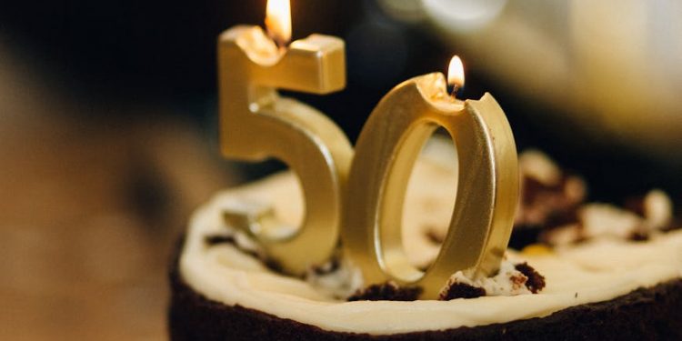 birthday cake with lighted candles on top